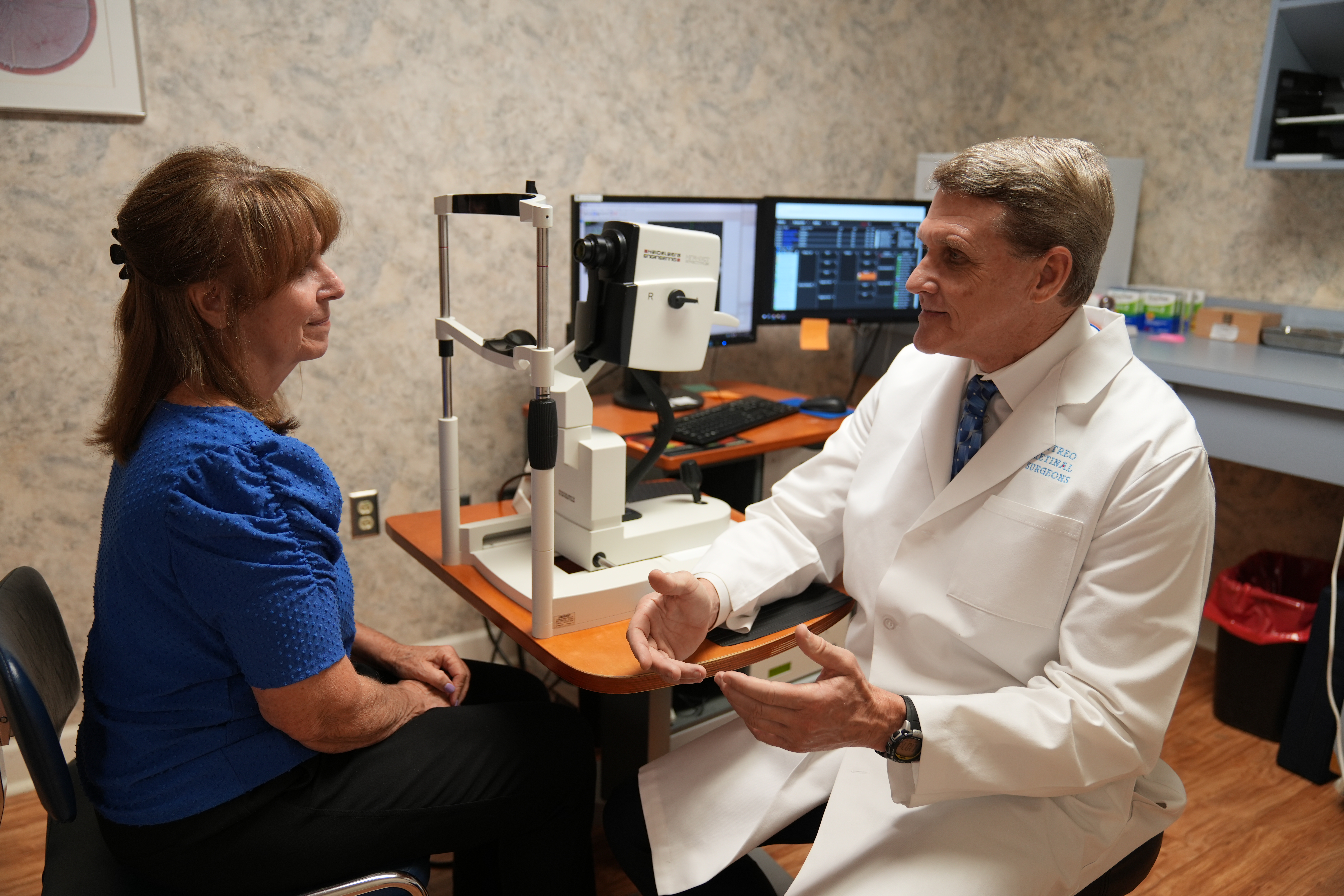 A provider talking to his female patient