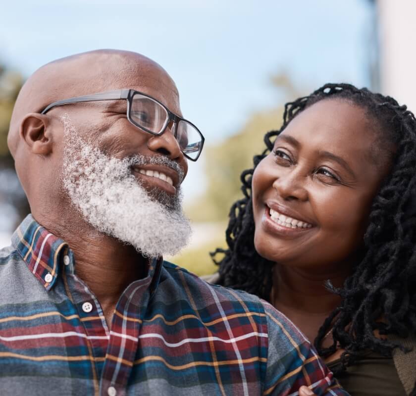 Two people smiling at each other